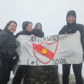 4 of our school staff at the top of Mount Snowdon