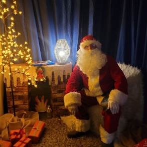 Santa Claus sat in his School Grotto